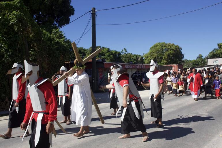 Members of St Paul's Anglican Church Nuku'alofa process the way of the cross through the streets on Good Friday 2026.
