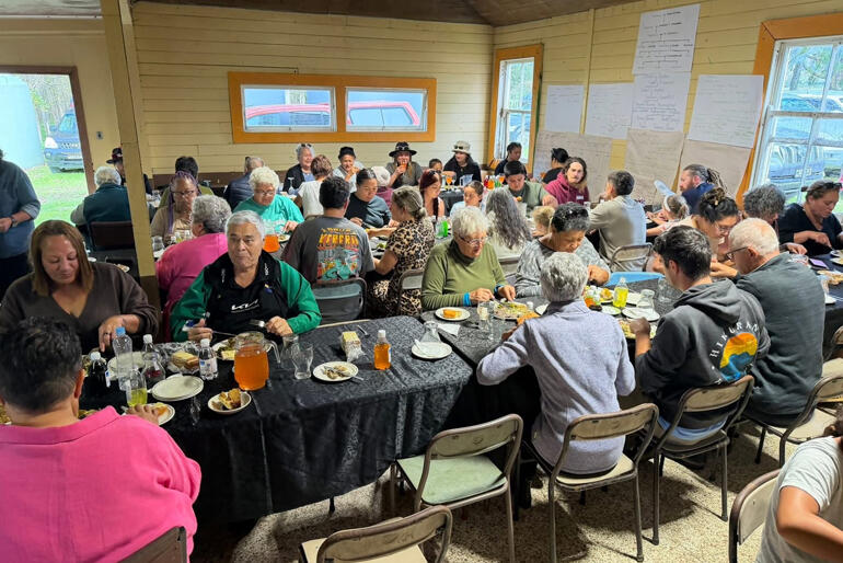 The community gathers for a meal following Archbishop Don Tamihere's Easter service with 3 baptisms and 17 confirmations at Rākaihoea whare.