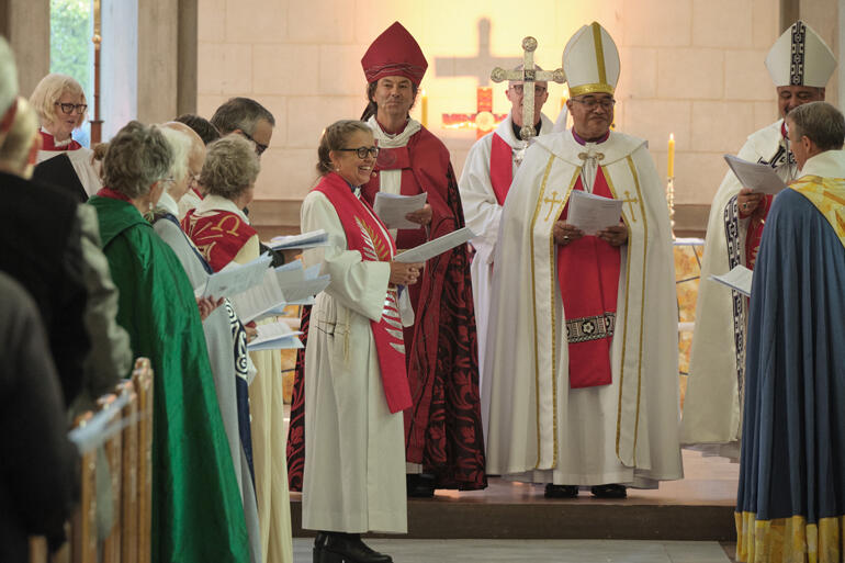 Bishop-elect Anne laughs as Archdeacon Damon Plimmer speaks. Bishop-elect Anne laughs as Archdeacon Damon Plimmer speaks.