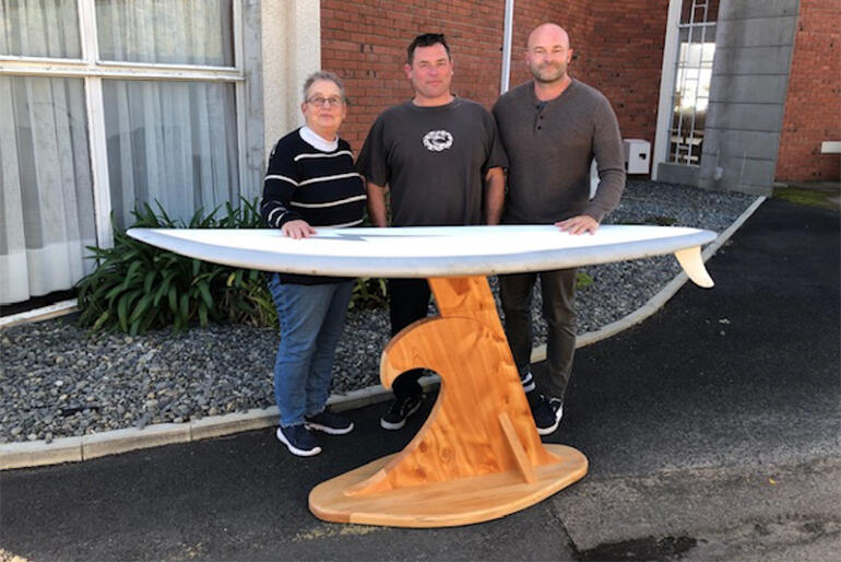 Rev Linda King, Ross Anderson & Carl Tinnion showcase the surf church altar on its way to St Nicholas Church, Ohope.