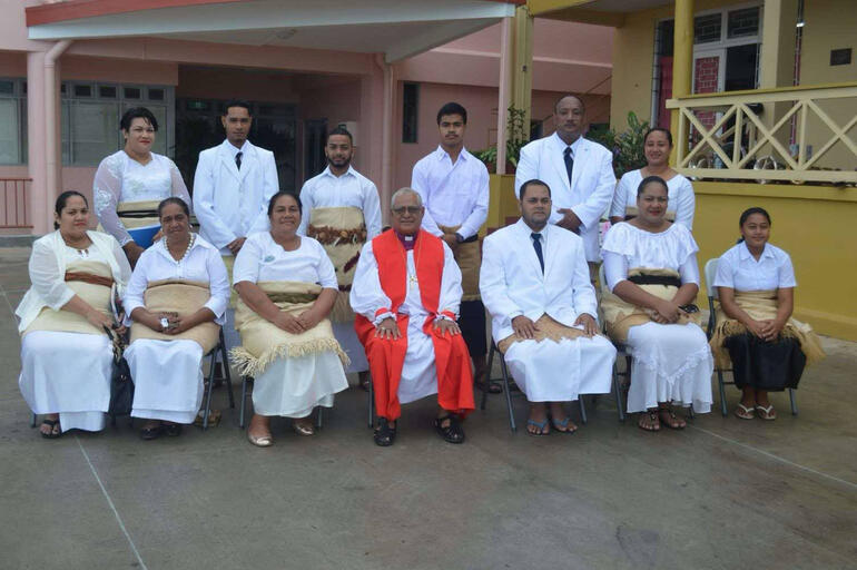 Bishop 'Afa lines up for a photo with staff from St Andrew's Anglican High School in Nuku'alofa. Bishop 'Afa lines up for a photo with staff from St Andrew's Anglican High School in Nuku'alofa.
