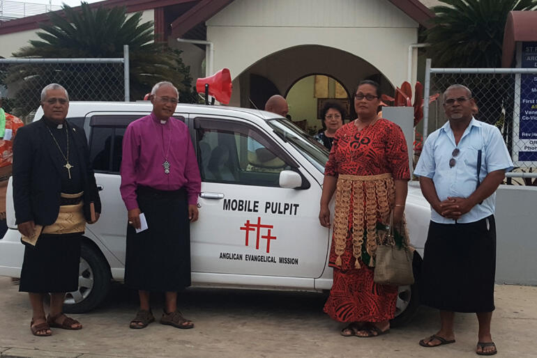 Bishop 'Afa Vaka (L) shows off his mobile pulpit van during a visit from Archbishop Winston Halapua. Bishop 'Afa Vaka (L) shows off his mobile pulpit van during a visit from Archbishop Winston Halapua.